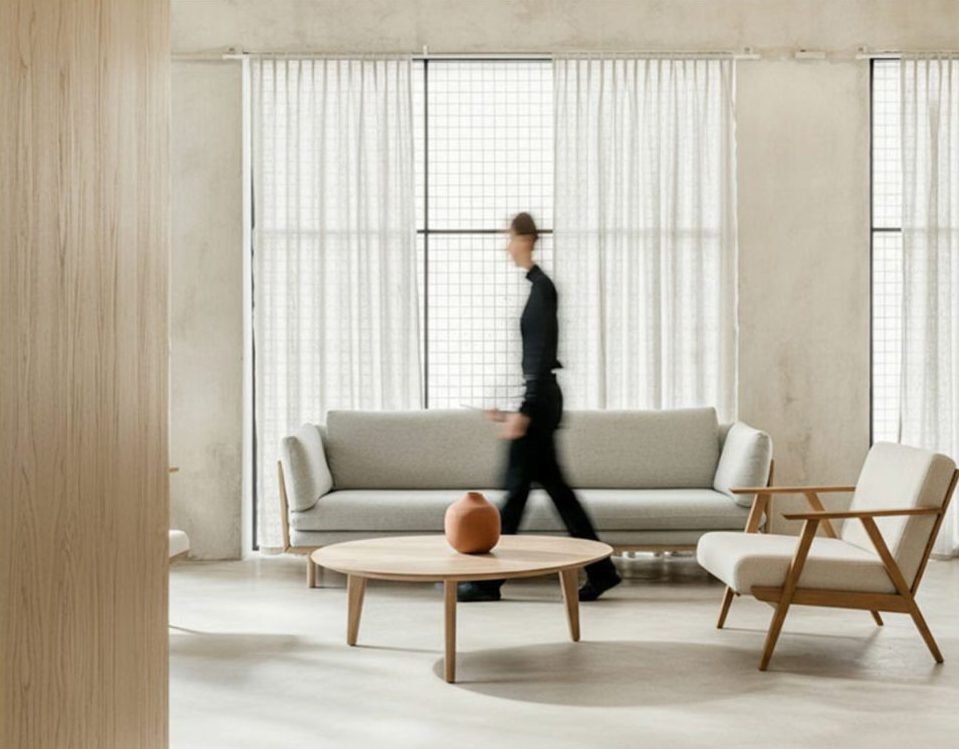 Light living room with a walnut coffee table and lounge chair